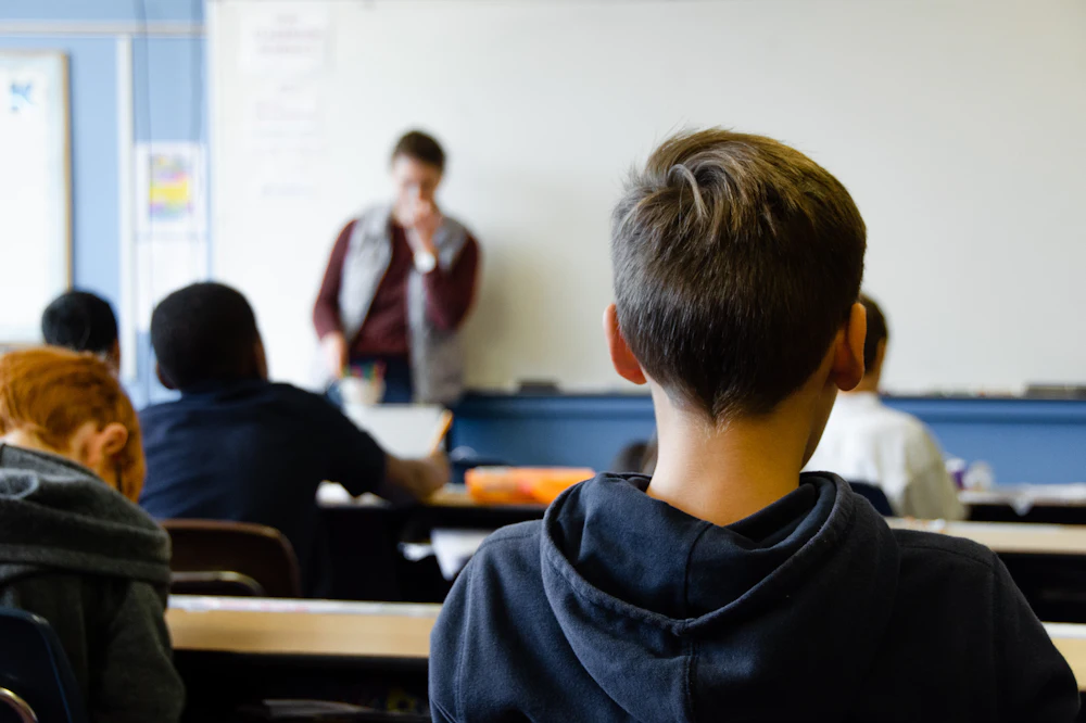 Teacher with students in a school classroom